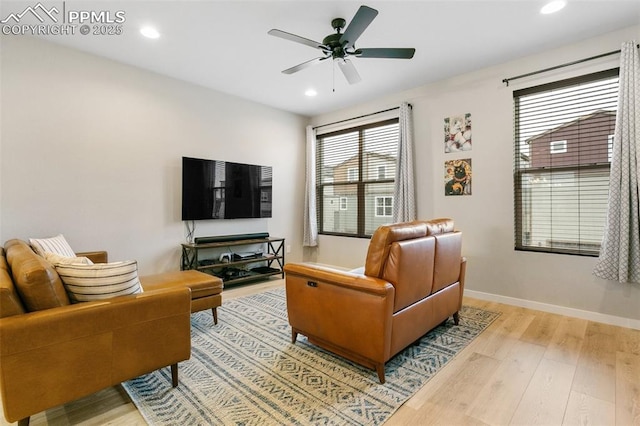 6697 Cool Breeze Dr, Colorado Springs, CO 80923 - living room with wood finished floors, plenty of natural light, a ceiling fan, and recessed lighting