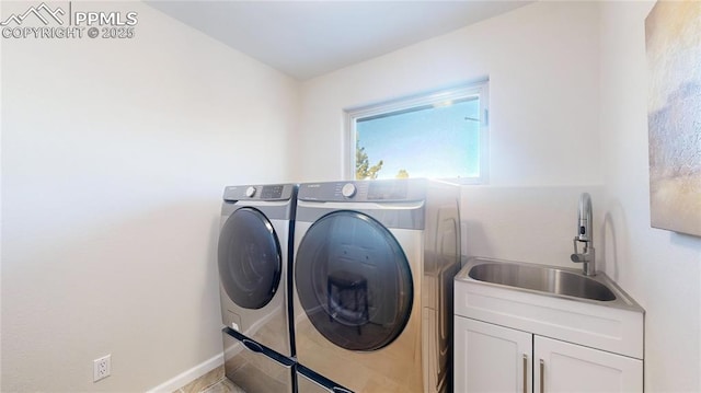 6260 Rain Dance Trl, Littleton, CO 80125 - laundry area featuring cabinet space, washer and dryer, and baseboards