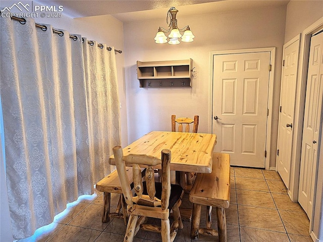 707 Valley View Dr, Woodland Park, CO 80863 - dining space with light tile patterned floors and a chandelier