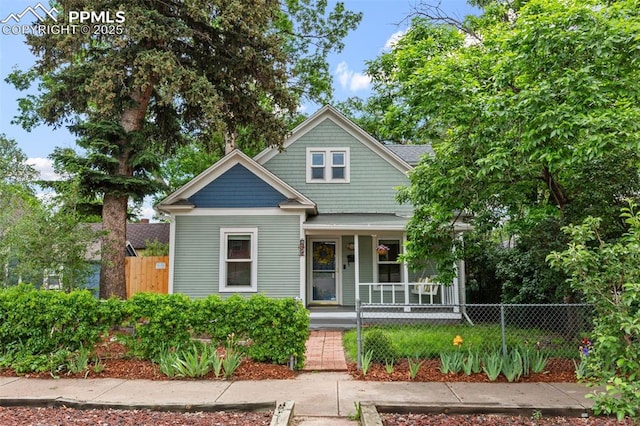 421 N Spruce St, Colorado Springs, CO 80905 - view of front of house with a porch and a fenced front yard