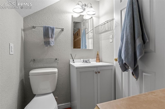421 N Spruce St, Colorado Springs, CO 80905 - full bath with vanity, toilet, and a textured wall