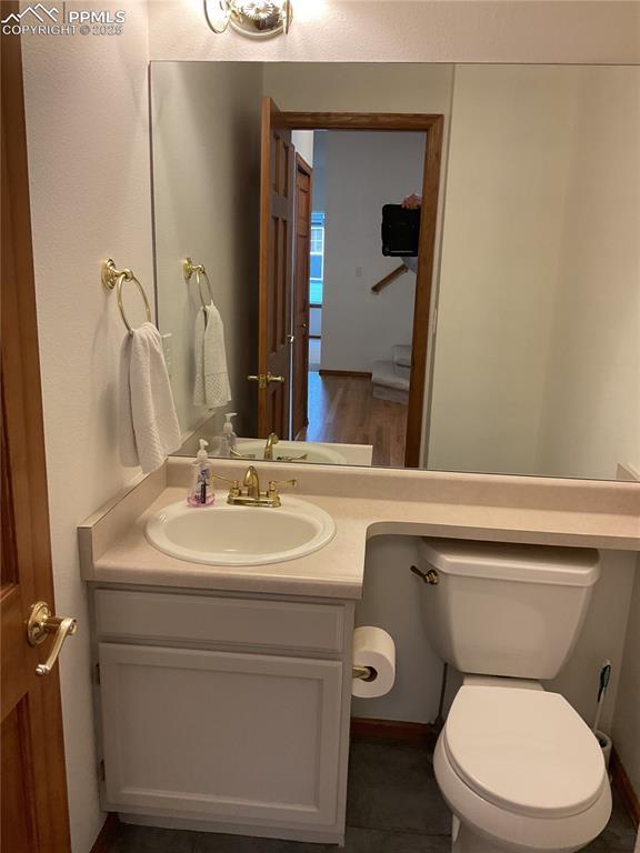 1185 Marlstone Pl, Colorado Springs, CO 80904 - half bath featuring vanity and toilet