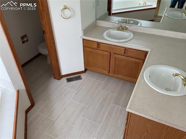 1185 Marlstone Pl, Colorado Springs, CO 80904 - full bathroom with vanity and toilet