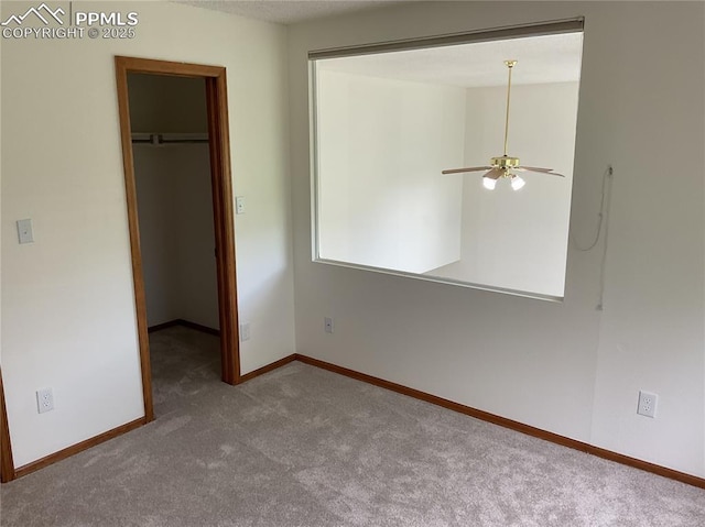 1185 Marlstone Pl, Colorado Springs, CO 80904 - unfurnished bedroom featuring a spacious closet, carpet, and a closet