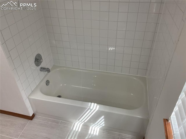 1185 Marlstone Pl, Colorado Springs, CO 80904 - bathroom with baseboards and bathing tub / shower combination