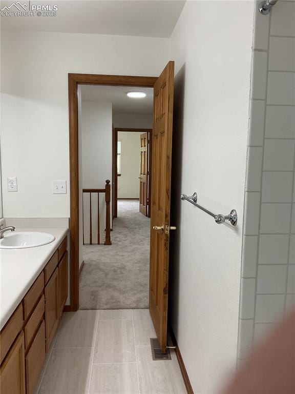 1185 Marlstone Pl, Colorado Springs, CO 80904 - bathroom with vanity and tile patterned flooring