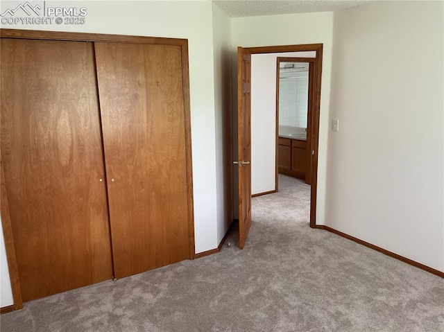 1185 Marlstone Pl, Colorado Springs, CO 80904 - unfurnished bedroom featuring carpet floors and a closet
