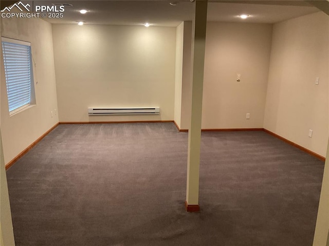 1185 Marlstone Pl, Colorado Springs, CO 80904 - below grade area featuring a baseboard radiator and carpet floors