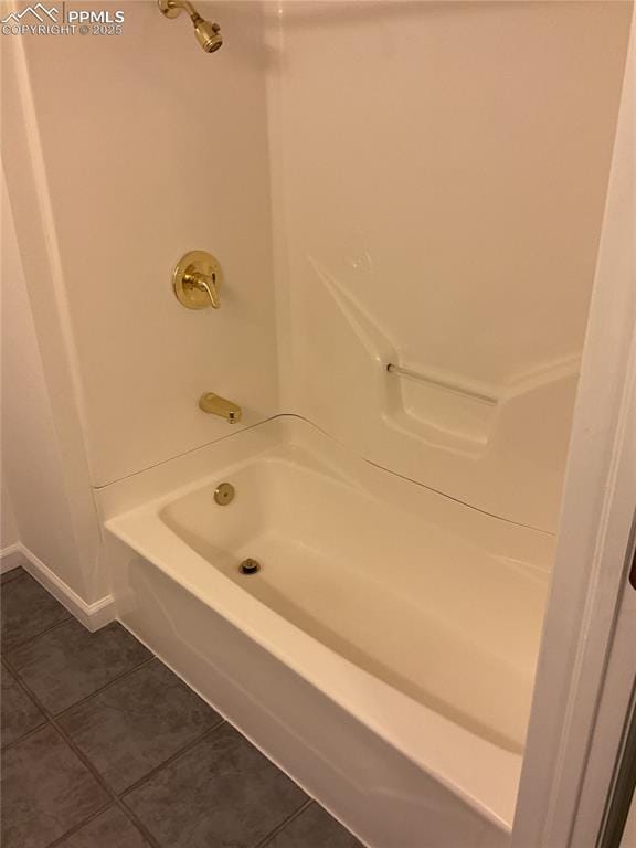 1185 Marlstone Pl, Colorado Springs, CO 80904 - bathroom with tile patterned floors and washtub / shower combination