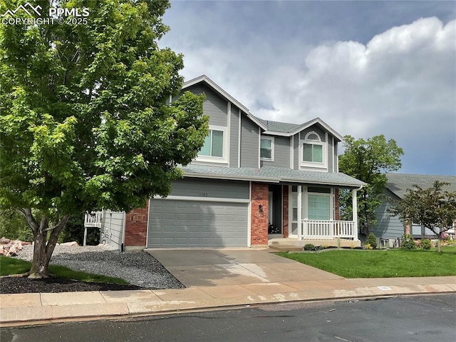 1185 Marlstone Pl, Colorado Springs, CO 80904 - view of front of house featuring a porch, a garage, driveway, and brick siding