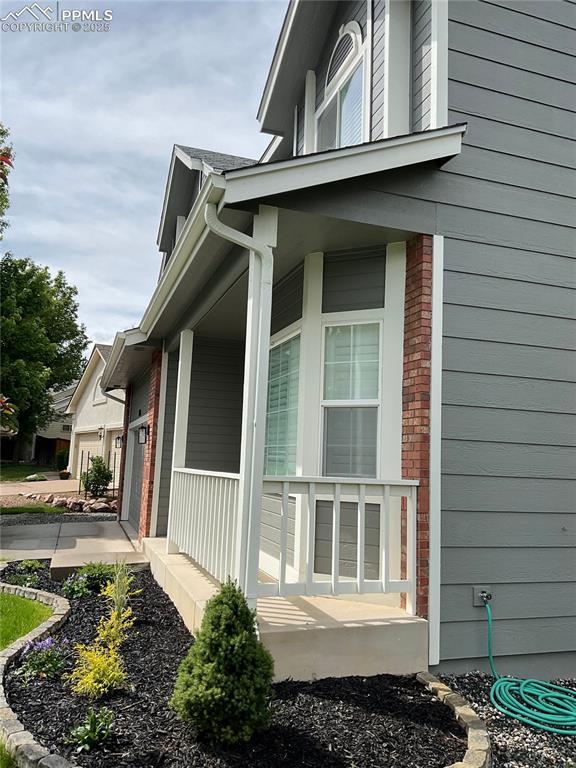 1185 Marlstone Pl, Colorado Springs, CO 80904 - view of home's exterior featuring covered porch