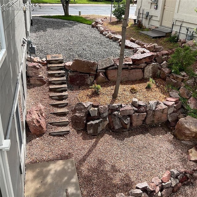 1185 Marlstone Pl, Colorado Springs, CO 80904 - view of yard with entry steps