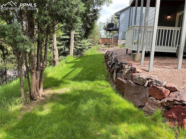 1185 Marlstone Pl, Colorado Springs, CO 80904 - view of grassy yard featuring a deck