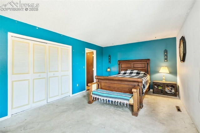 965 Red Mesa Dr, Colorado Springs, CO 80906 - bedroom featuring unfinished concrete flooring and a closet