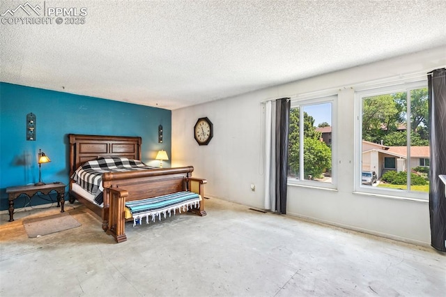 965 Red Mesa Dr, Colorado Springs, CO 80906 - bedroom featuring a textured ceiling and concrete flooring