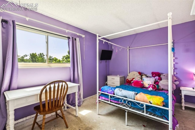 965 Red Mesa Dr, Colorado Springs, CO 80906 - bedroom featuring a textured ceiling and concrete flooring
