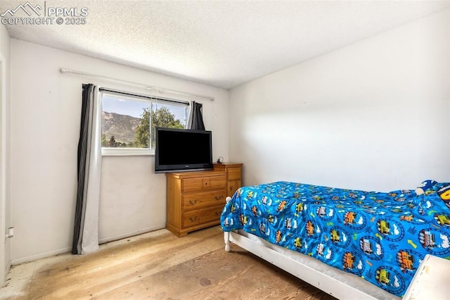 965 Red Mesa Dr, Colorado Springs, CO 80906 - bedroom with baseboards and a textured ceiling
