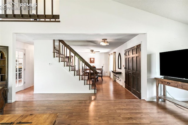 965 Red Mesa Dr, Colorado Springs, CO 80906 - entrance foyer featuring stairs, wood finished floors, ceiling fan, and vaulted ceiling