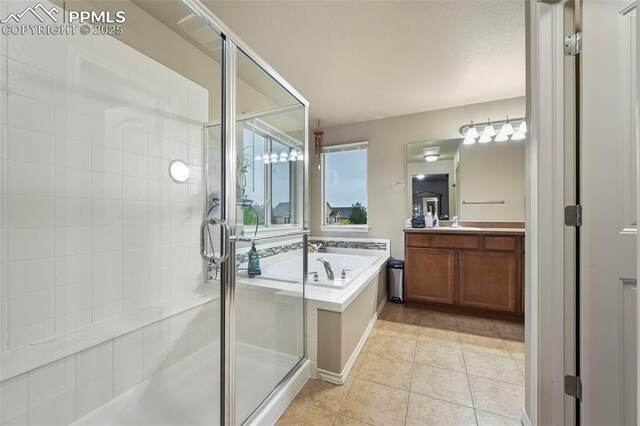 2374 Cinnabar Rd, Colorado Springs, CO 80921 - full bathroom featuring vanity, a garden tub, a stall shower, and tile patterned floors