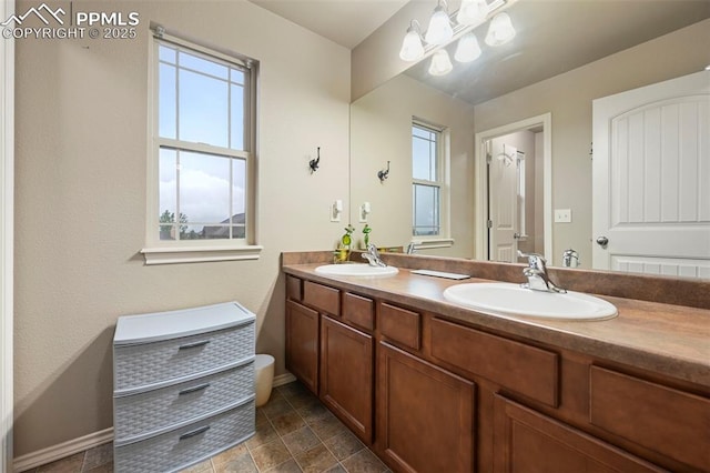 2374 Cinnabar Rd, Colorado Springs, CO 80921 - full bathroom featuring healthy amount of natural light and double vanity