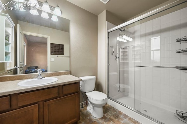2374 Cinnabar Rd, Colorado Springs, CO 80921 - full bathroom featuring a shower stall, vanity, and stone finish floors