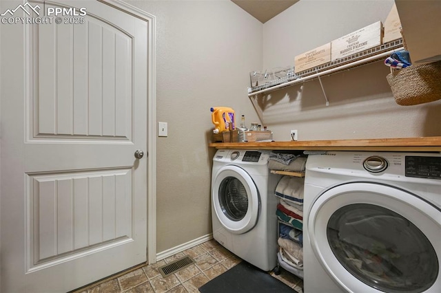 2374 Cinnabar Rd, Colorado Springs, CO 80921 - washroom with separate washer and dryer and baseboards