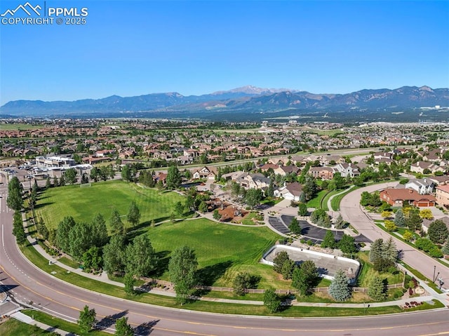 2374 Cinnabar Rd, Colorado Springs, CO 80921 - aerial overview of property's location with a mountainous background and nearby suburban area