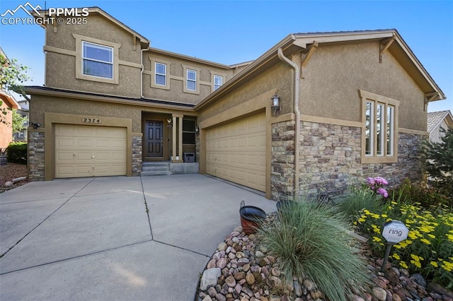 2374 Cinnabar Rd, Colorado Springs, CO 80921 - view of front of house with stone siding, stucco siding, concrete driveway, and an attached garage