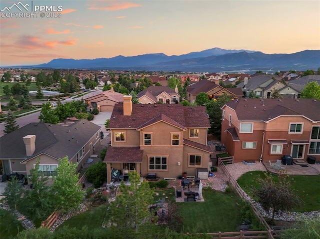 2374 Cinnabar Rd, Colorado Springs, CO 80921 - aerial view at dusk of a residential view and a mountain view