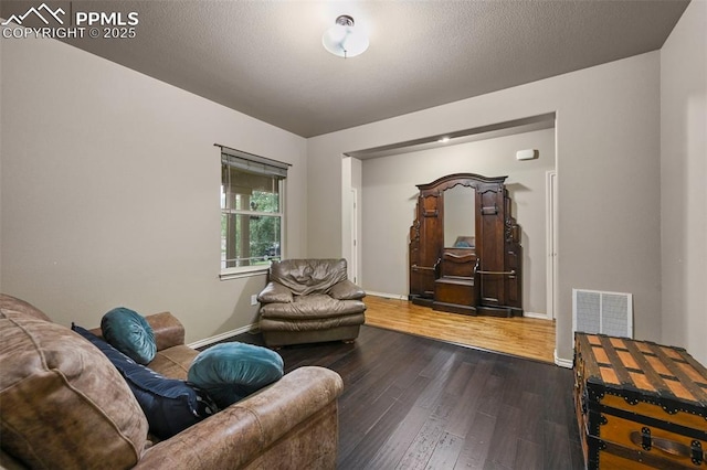 2374 Cinnabar Rd, Colorado Springs, CO 80921 - living room featuring dark wood-style flooring and baseboards