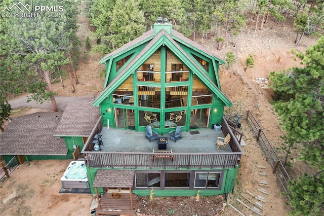 145 Valley Ln, Woodland Park, CO 80863 - back of house featuring a wooden deck and a chimney