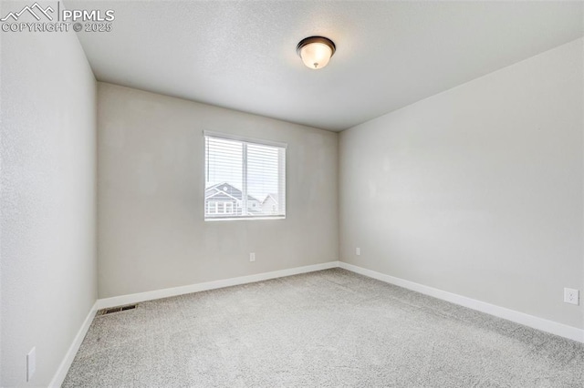 6967 Akela Ln, Colorado Springs, CO 80925 - empty room featuring carpet floors and baseboards