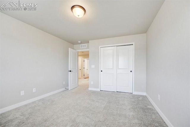 6967 Akela Ln, Colorado Springs, CO 80925 - unfurnished bedroom with carpet, baseboards, and a closet