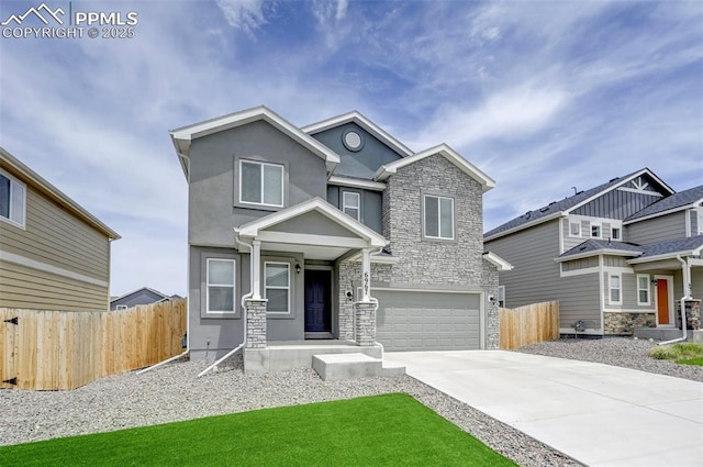 6967 Akela Ln, Colorado Springs, CO 80925 - view of front of property featuring stone siding, an attached garage, driveway, and stucco siding