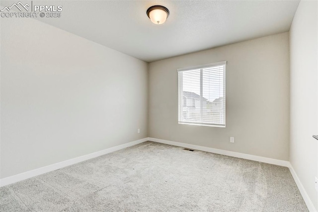 6967 Akela Ln, Colorado Springs, CO 80925 - carpeted spare room featuring baseboards