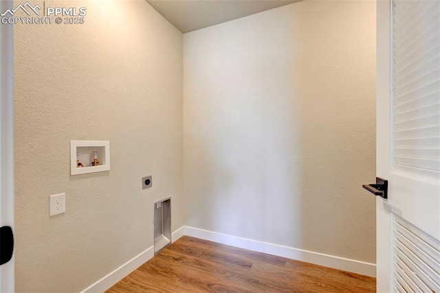 6967 Akela Ln, Colorado Springs, CO 80925 - laundry room with washer hookup, hookup for an electric dryer, wood finished floors, and baseboards