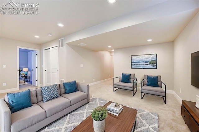 6967 Akela Ln, Colorado Springs, CO 80925 - living area featuring light carpet, recessed lighting, and baseboards