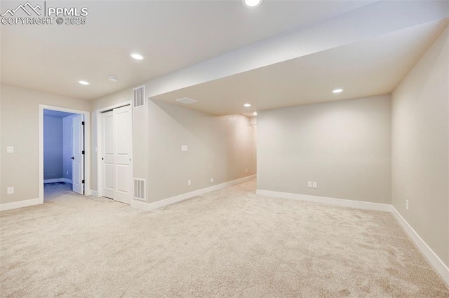 6967 Akela Ln, Colorado Springs, CO 80925 - finished below grade area featuring light colored carpet, recessed lighting, and baseboards