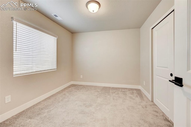 6967 Akela Ln, Colorado Springs, CO 80925 - empty room featuring carpet floors and baseboards