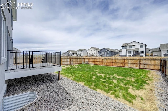 6967 Akela Ln, Colorado Springs, CO 80925 - view of yard with a residential view and a wooden deck