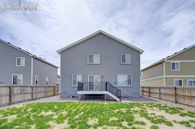 6967 Akela Ln, Colorado Springs, CO 80925 - rear view of house with stucco siding