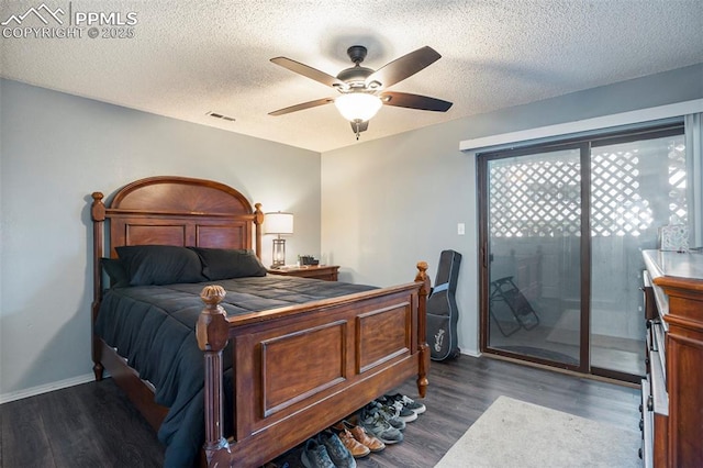 1228 Firefly Cir, Colorado Springs, CO 80916 - bedroom featuring access to exterior, dark wood-style flooring, a textured ceiling, and ceiling fan