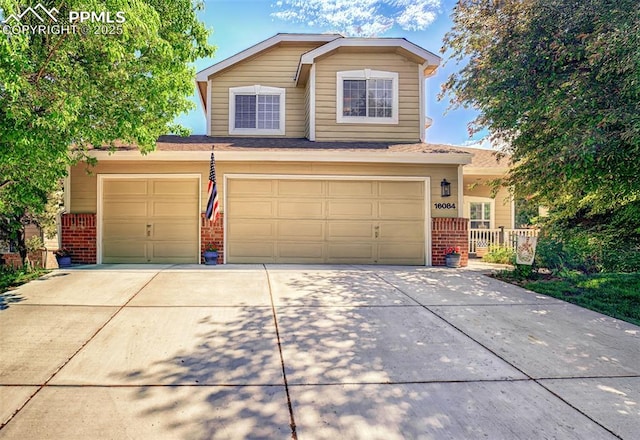 16084 Stonebriar Dr, Parker, CO 80134 - traditional-style home with brick siding, driveway, and a garage