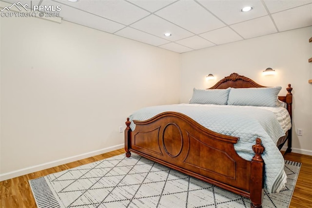 16084 Stonebriar Dr, Parker, CO 80134 - bedroom with baseboards, a paneled ceiling, light wood-style floors, and recessed lighting
