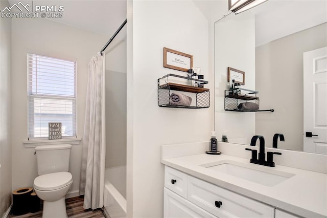16084 Stonebriar Dr, Parker, CO 80134 - bathroom with toilet, vanity, shower / bath combo, and wood finished floors