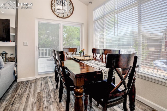 16084 Stonebriar Dr, Parker, CO 80134 - dining space with a chandelier, baseboards, and wood finished floors