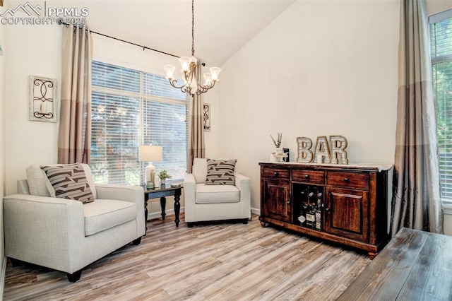 16084 Stonebriar Dr, Parker, CO 80134 - sitting room with a chandelier, light wood-type flooring, and lofted ceiling