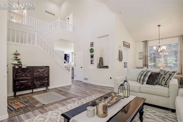 16084 Stonebriar Dr, Parker, CO 80134 - living room featuring high vaulted ceiling, wood finished floors, a chandelier, stairs, and baseboards