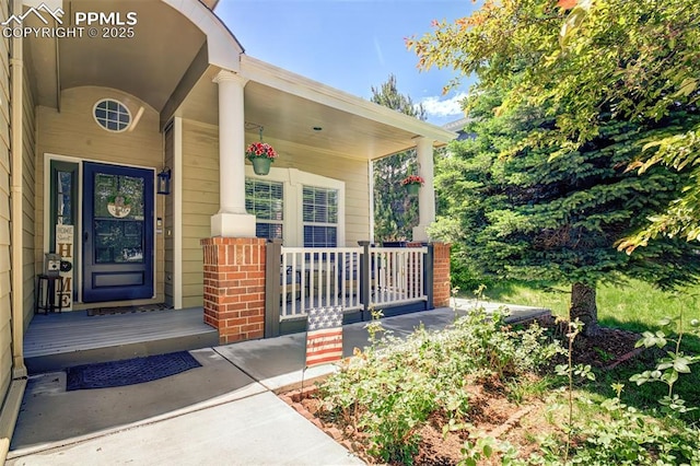 16084 Stonebriar Dr, Parker, CO 80134 - entrance to property featuring covered porch and brick siding