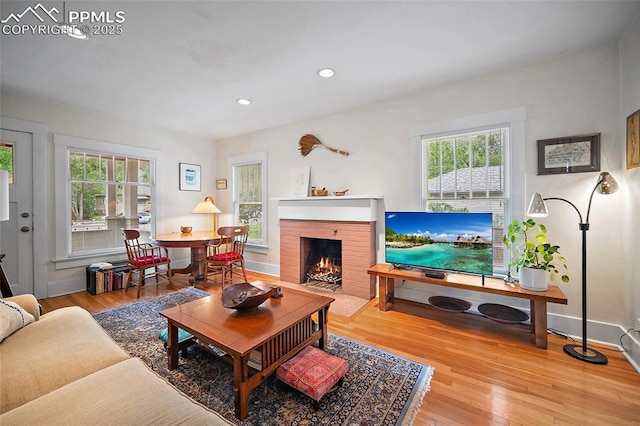 424 N Cedar St, Colorado Springs, CO 80903 - living room featuring recessed lighting, wood finished floors, a fireplace, and baseboards